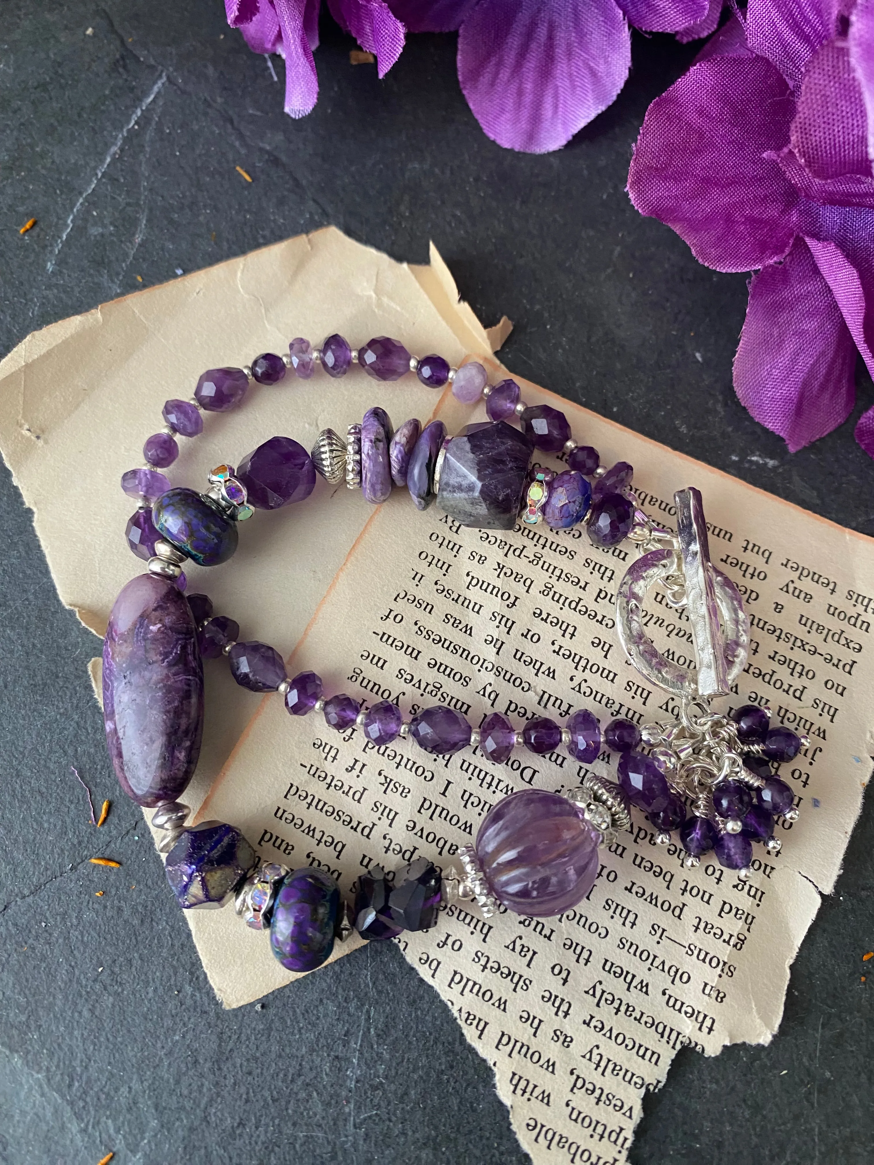 Amethyst gemstone, charoite stone, lampwork glass, silver metal, bracelet.