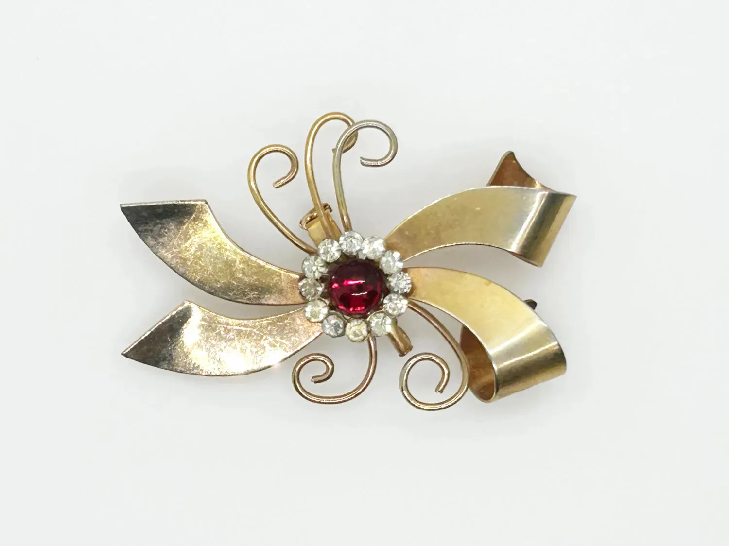 Vintage Abstract Bow Brooch with Red Cabochon and Bright Rhinestones